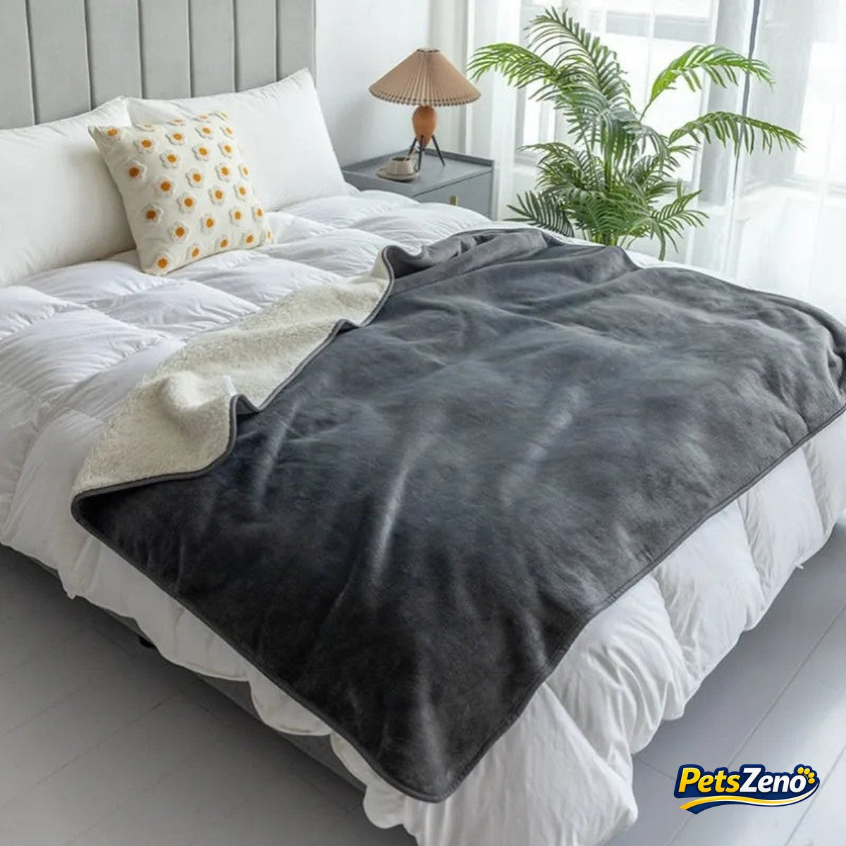 Waterproof sherpa dog blanket on a bed – PetsZeno